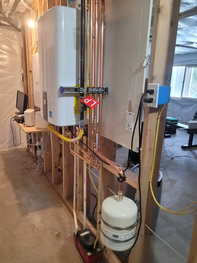 Licensed plumber repairing a kitchen sink in Ridgefield