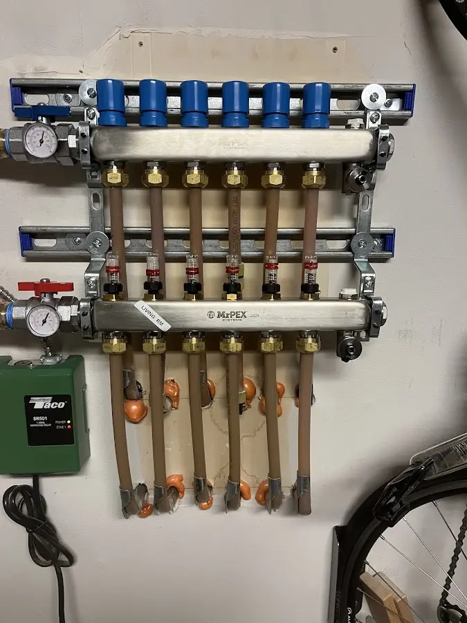 Plumber performing Water Heater Repair at a residential property in Ridgefield